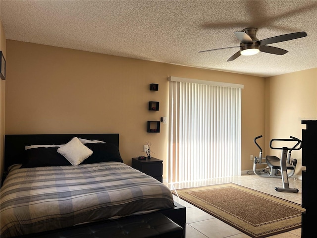 909 Royalton Rd, Orlando, FL 32825 - bedroom with a textured ceiling, a ceiling fan, and tile patterned flooring