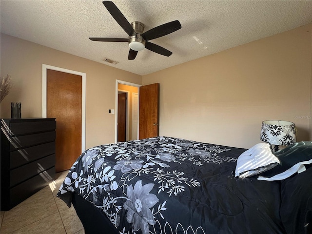 909 Royalton Rd, Orlando, FL 32825 - bedroom with tile patterned flooring, a textured ceiling, and ceiling fan