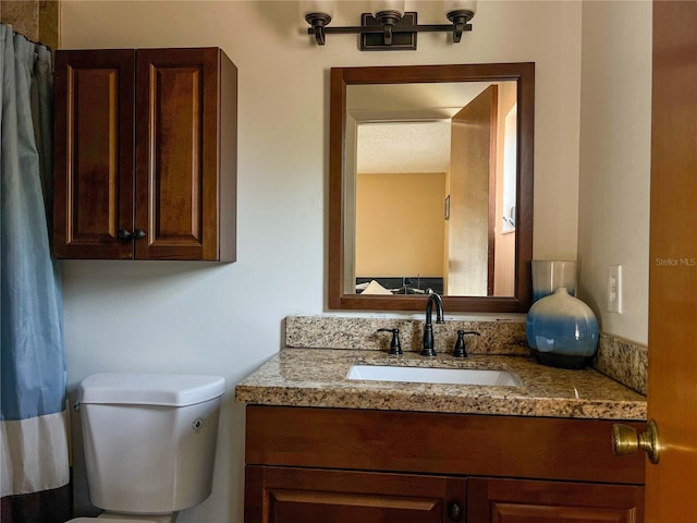 909 Royalton Rd, Orlando, FL 32825 - full bathroom featuring vanity and toilet
