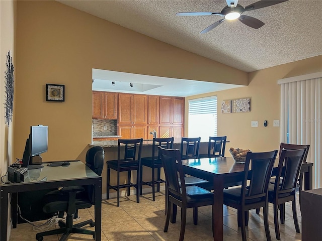 909 Royalton Rd, Orlando, FL 32825 - dining room with lofted ceiling, a ceiling fan, light tile patterned floors, a textured ceiling, and an office area