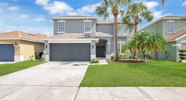 726 Lake Biscayne Way, Orlando, FL 32824 - view of front of home with stucco siding, a garage, driveway, and a front lawn