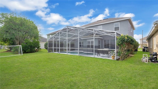 726 Lake Biscayne Way, Orlando, FL 32824 - rear view of property featuring a patio, stucco siding, a lawn, and an outdoor pool