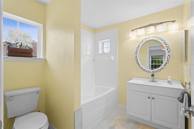 bathroom featuring toilet, baseboards, tile patterned flooring, and vanity