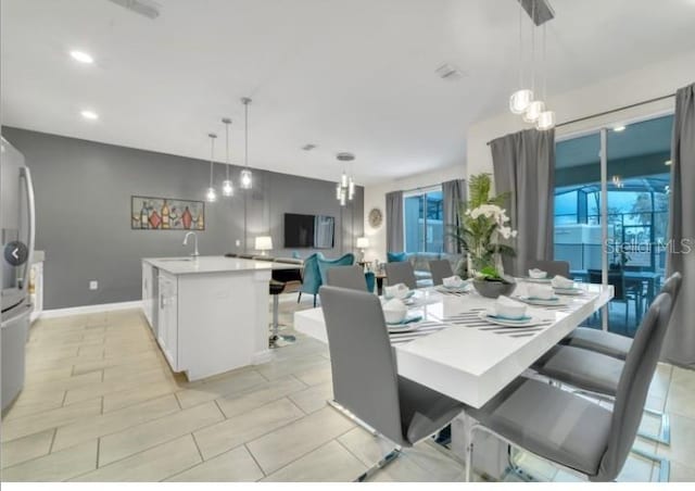 4983 Windermere Ave, Kissimmee, FL 34746 - dining space featuring recessed lighting, baseboards, and light tile patterned flooring