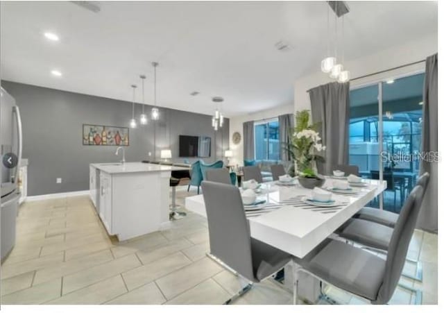 4983 Windermere Ave, Kissimmee, FL 34746 - dining space with recessed lighting, baseboards, and light tile patterned floors