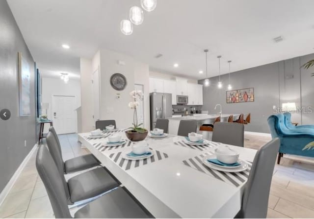 4983 Windermere Ave, Kissimmee, FL 34746 - dining area with baseboards and recessed lighting