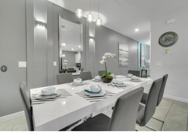 4983 Windermere Ave, Kissimmee, FL 34746 - dining room with baseboards and light tile patterned flooring