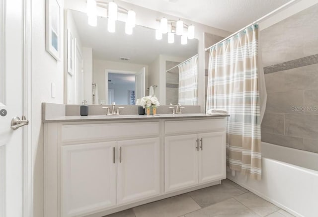 4983 Windermere Ave, Kissimmee, FL 34746 - full bath with double vanity, tile patterned flooring, and shower / bath combo