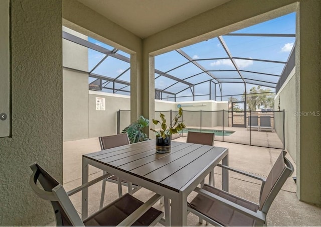4983 Windermere Ave, Kissimmee, FL 34746 - view of patio / terrace featuring an outdoor pool, outdoor dining space, and glass enclosure
