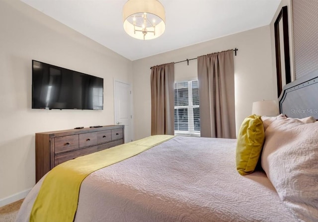 4983 Windermere Ave, Kissimmee, FL 34746 - bedroom with a chandelier and carpet