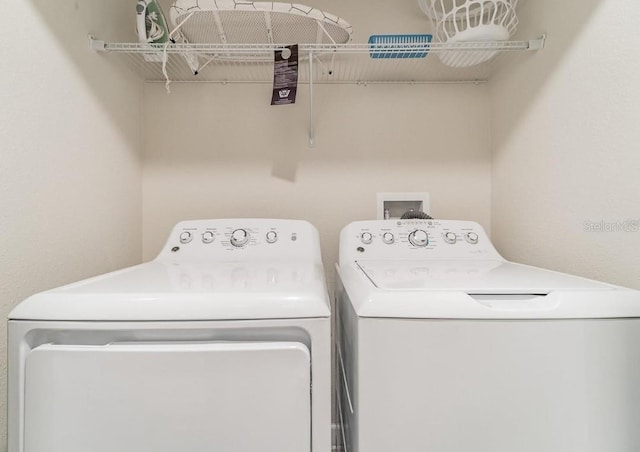 4983 Windermere Ave, Kissimmee, FL 34746 - laundry room featuring washer and clothes dryer