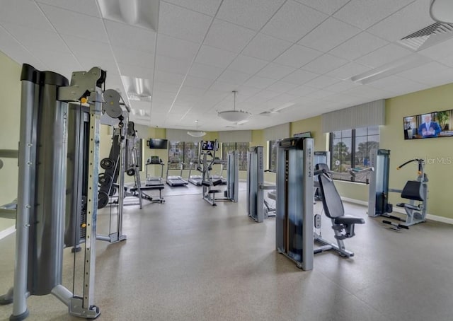 4983 Windermere Ave, Kissimmee, FL 34746 - gym featuring a paneled ceiling and baseboards