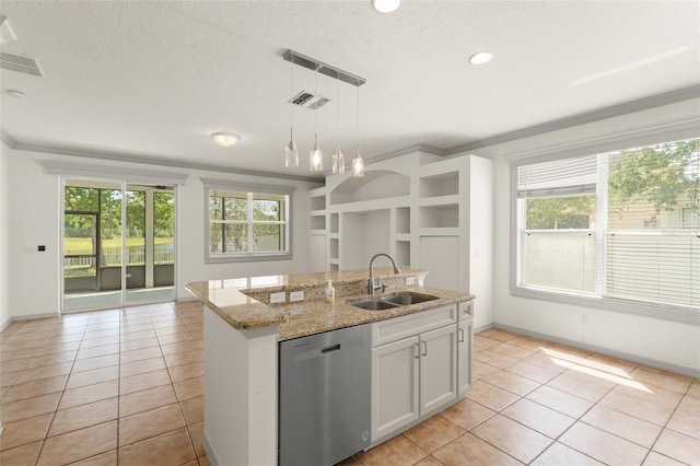 kitchen with a sink, dishwasher, light tile patterned flooring, healthy amount of natural light, and ornamental molding