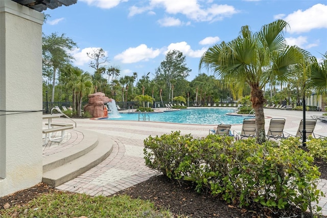 community pool featuring a patio area