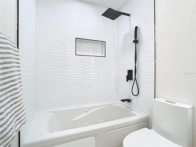 full bath with toilet and a combined bath / shower with jetted tub