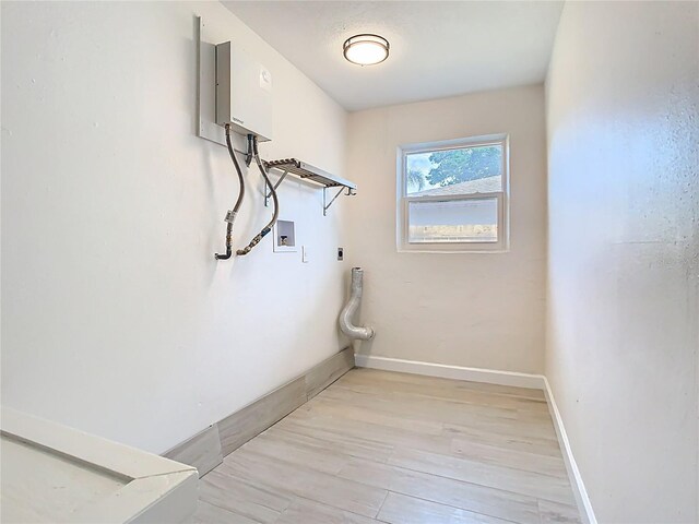 laundry room with washer hookup, electric dryer hookup, baseboards, and light wood finished floors