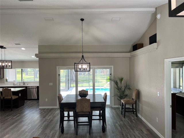 dining space featuring baseboards, dark wood-style flooring, and a notable chandelier