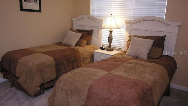 bedroom featuring carpet