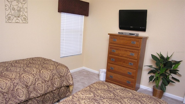 carpeted bedroom with baseboards