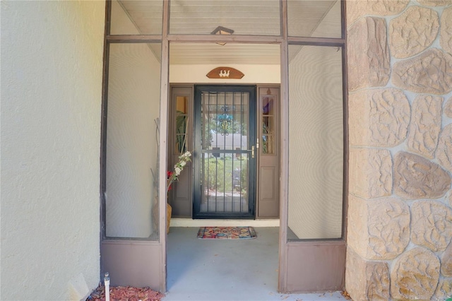 7418 Riverbank Dr, New Port Richey, FL 34655 - doorway to property featuring stucco siding