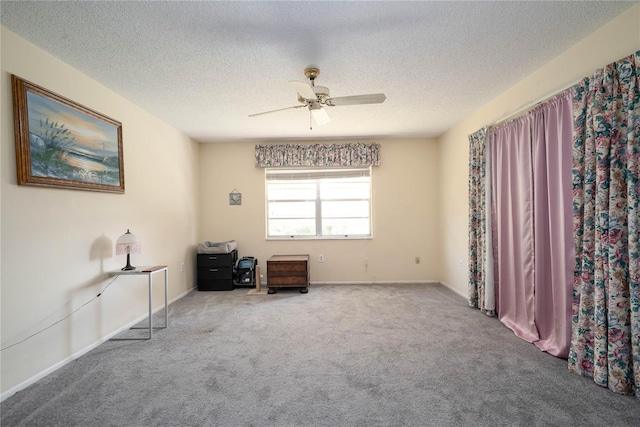 7418 Riverbank Dr, New Port Richey, FL 34655 - carpeted empty room featuring a ceiling fan, a textured ceiling, and baseboards