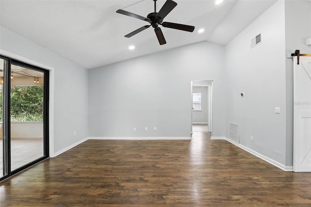 spare room with a wealth of natural light, visible vents, and wood finished floors