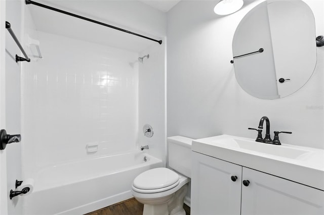 full bath featuring vanity, toilet, shower / washtub combination, and wood finished floors