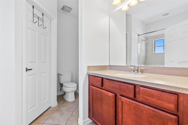 bathroom with visible vents, tile patterned flooring, vanity, a shower, and toilet