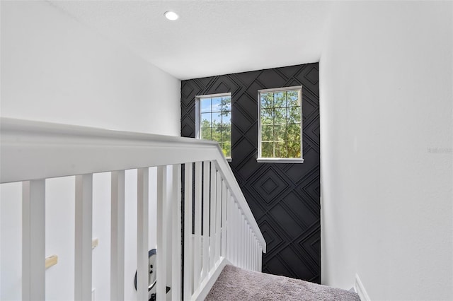 stairs with an accent wall