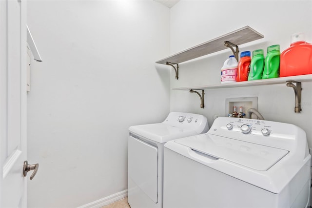 laundry room with independent washer and dryer, laundry area, and baseboards