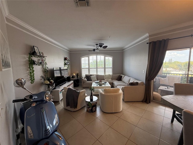 4333 Bayside Village Dr Unit 310, Tampa, FL 33615 - living room featuring ornamental molding, light tile patterned floors, and ceiling fan