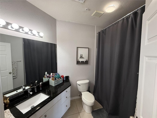 4333 Bayside Village Dr Unit 310, Tampa, FL 33615 - full bath with tile patterned floors, vanity, toilet, a textured ceiling, and a shower with curtain