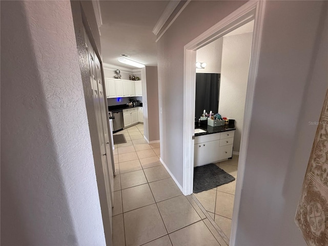 4333 Bayside Village Dr Unit 310, Tampa, FL 33615 - hallway with crown molding, light tile patterned floors, and a textured wall