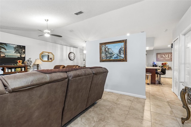 5113 Sage Way, Kissimmee, FL 34758 - living room with ceiling fan, light tile patterned floors, lofted ceiling, and baseboards