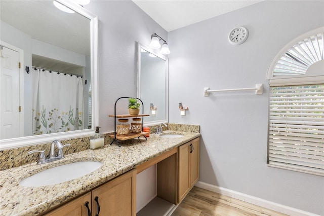5113 Sage Way, Kissimmee, FL 34758 - full bathroom with wood finished floors, double vanity, baseboards, and curtained shower