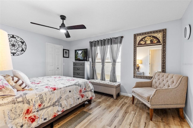 5113 Sage Way, Kissimmee, FL 34758 - bedroom with light wood-type flooring, baseboards, a ceiling fan, and a closet