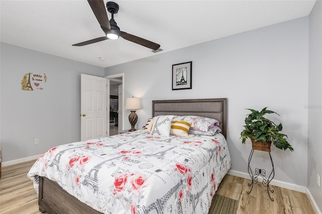5113 Sage Way, Kissimmee, FL 34758 - bedroom with light wood-style floors, baseboards, and ceiling fan