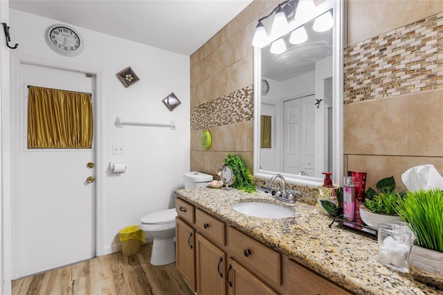 5113 Sage Way, Kissimmee, FL 34758 - bathroom featuring wood finished floors, vanity, and toilet