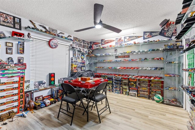 5113 Sage Way, Kissimmee, FL 34758 - dining space featuring a textured ceiling, ceiling fan, and wood finished floors