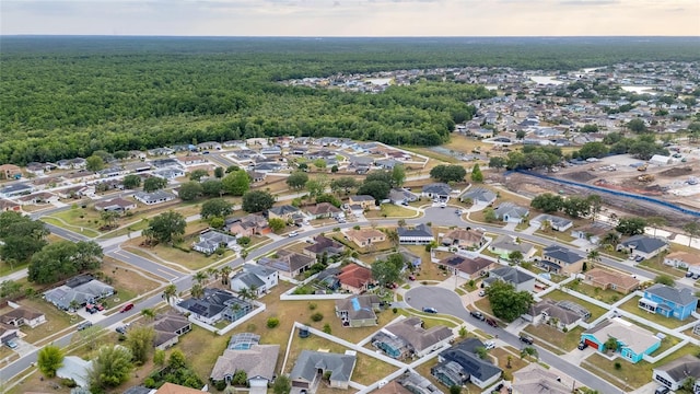 5113 Sage Way, Kissimmee, FL 34758 - aerial view of property and surrounding area featuring a forest and nearby suburban area