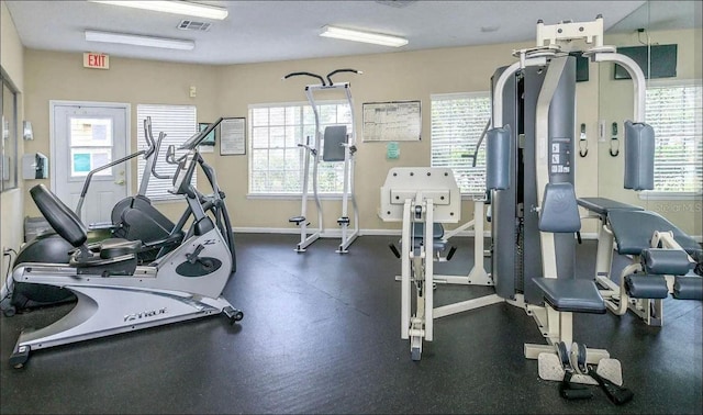 workout area with baseboards and visible vents