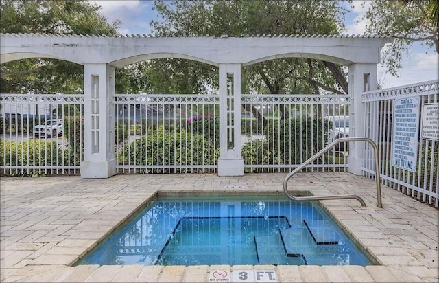 view of pool with fence and a swimming pool