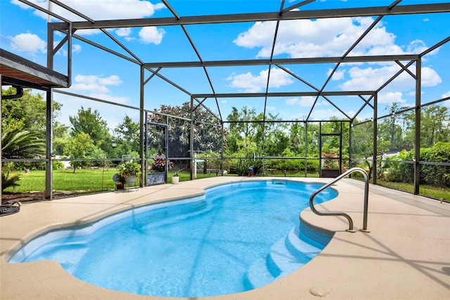 outdoor pool with a patio area and a lanai