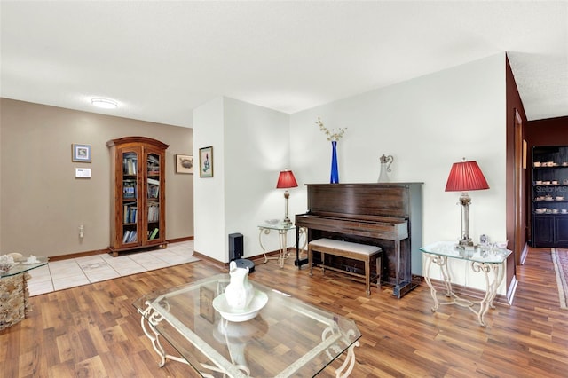 sitting room featuring light wood-style floors and baseboards