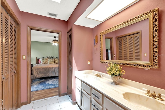 full bathroom featuring a sink, tile patterned flooring, and a closet