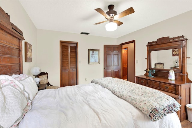bedroom featuring a closet, visible vents, and ceiling fan