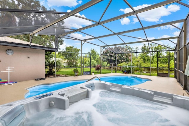 pool featuring a patio, a hot tub, and a lanai