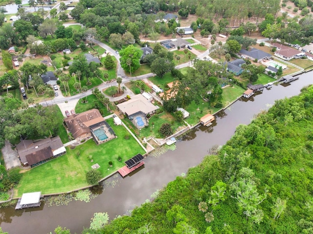 drone / aerial view featuring a water view and a residential view