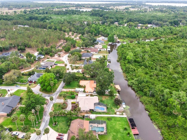 bird's eye view featuring a water view and a residential view
