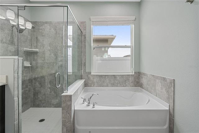 full bathroom featuring a stall shower and a bath